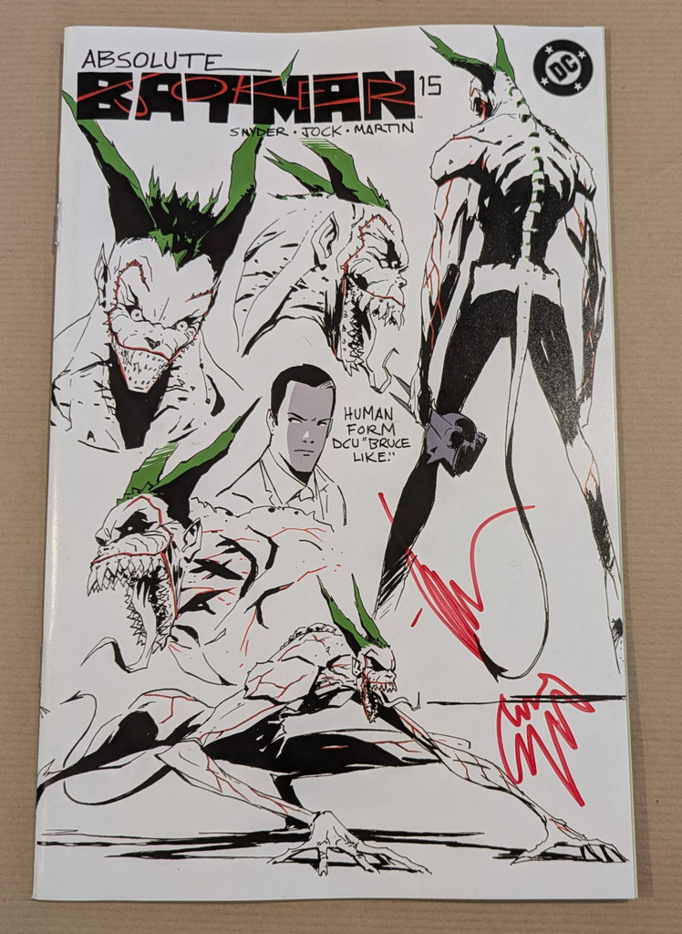 Comic book cover of 'Absolute Batman' with a signature on a beige background